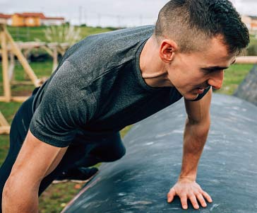 A man jumping over an obstacle.